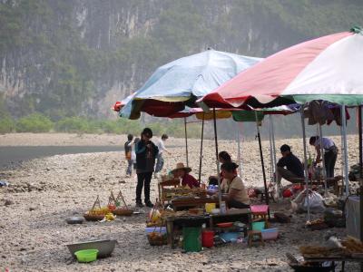 Food stalls on a bank in the Li River